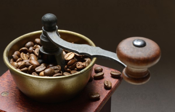 Coffee grinder with roasted coffee beans, grind coffee