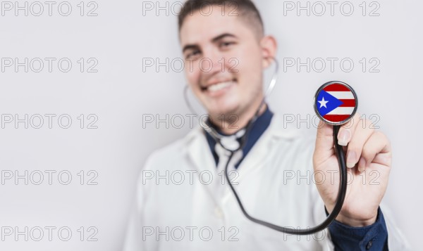 Doctor showing stethoscope with Puerto Rico flag. Puerto Rico national healthcare concept