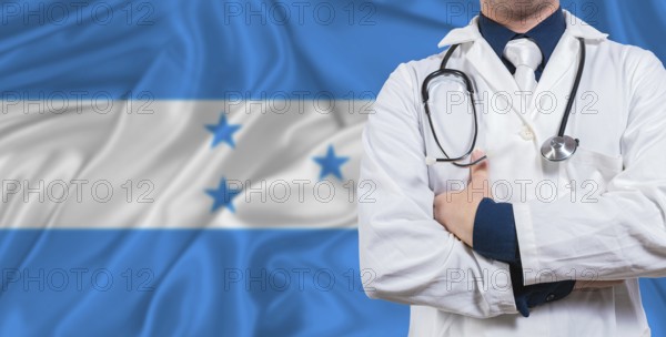 Male doctor with stethoscope on Honduras flag. Doctor holding stethoscope on Honduras flag