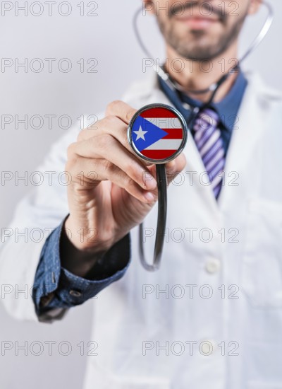 Puerto Rico health and medical insurance concept. Puerto Rico healthcare system, doctor holding stethoscope
