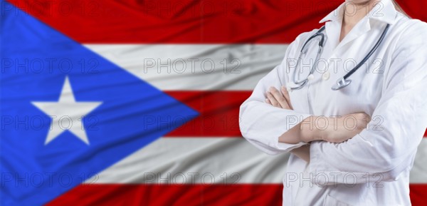 Doctor with crossed arms on Puerto Rico flag. Puerto Rico health and care concept. Female doctor on Puerto Rico flag