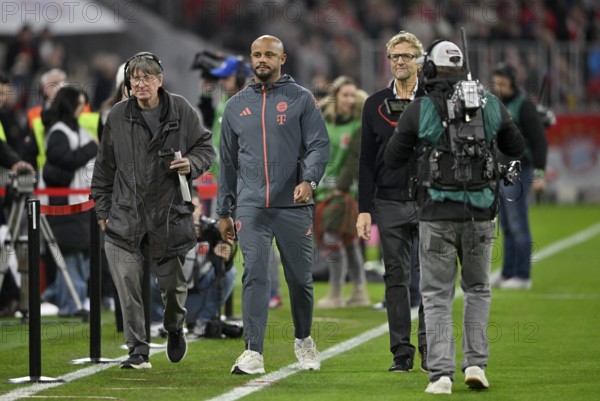 Coach coach Vincent Kompany FC Bayern Munich FCB on his way to an interview with press chief Dieter Nickles followed by Allianz Arena TV camera, Munich, Bayern, Germany