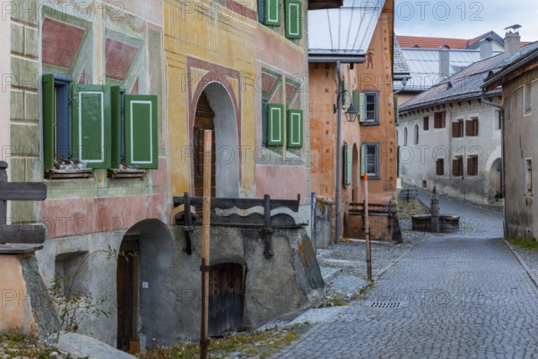Engadin houses, historic houses, Dorstrasse with stones, village fountain, Guarda, Engadin, Grisons, Switzerland
