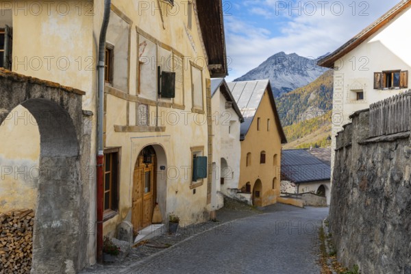 Engadin houses with sgraffiti, historic houses, village street with stones, Guarda, Engadin, Grisons, Switzerland