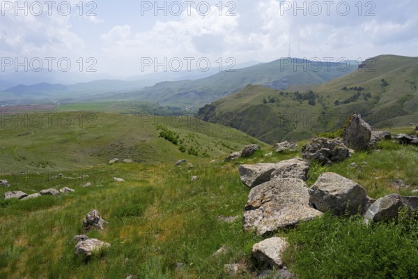 View of a hilly landscape with scattered stones and a wide panorama, landscape near Zorats Karer, Zorakarer, Karahundsch, Sisian, Sissian, Sjunik province, historically Sangesur, Armenia