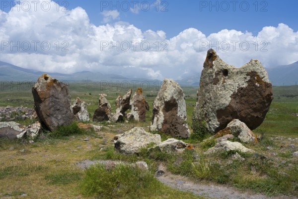 Stone monuments on a vast meadow under a cloudy sky, stone circle, megaliths, Zorats Karer, Karahundsch, Bronze Age burial ground, Sisian, Sissian, Sjunik province, historical Sangesur, Armenia