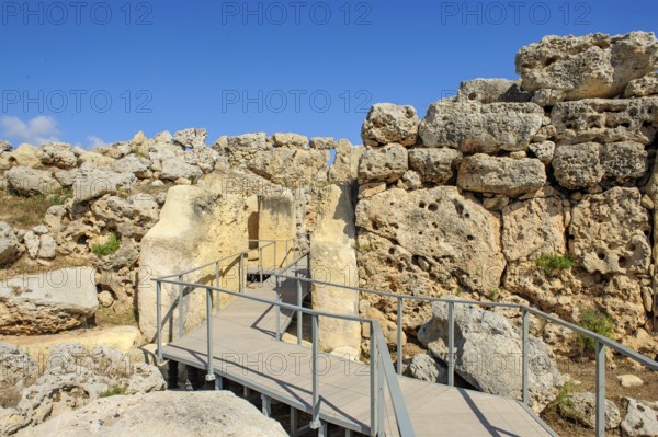 View from secured walkway with railing through ruins remains of Ggantija temple, UNESCO World Heritage Site, Gozo, MaltagGantija temple, UNESCO World Heritage Site, Gozo, Malta