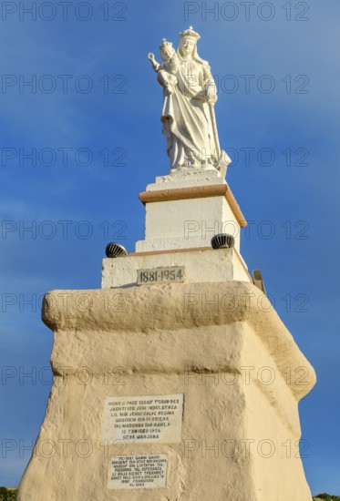 Christian religious statue of Madonna Mary Mother of God on Ramla Bay beach, Gozo island, Malta