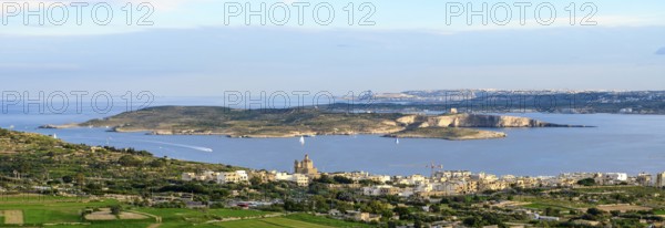 Panoramic view of three islands in the Mediterranean from the state of Malta in front island of Gozo in the middle small island of Comino in the background large island of Malta, Malta