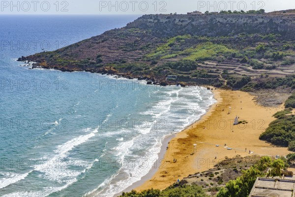 View from elevated position of beach in Ramla Bay, Gozo, Malta