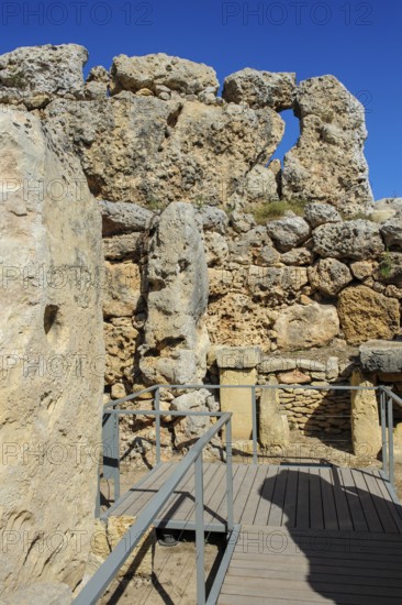 View from secured walkway with railing through ruins remains of Ggantija temple, UNESCO World Heritage Site, Gozo, MaltagGantija temple, UNESCO World Heritage Site, Gozo, Malta