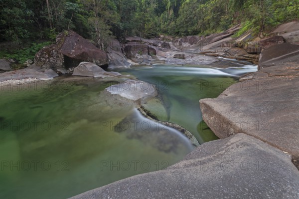 Turquoise blue water between rocks in the tropical rainforest of Babinda Boulders Queensland Australia