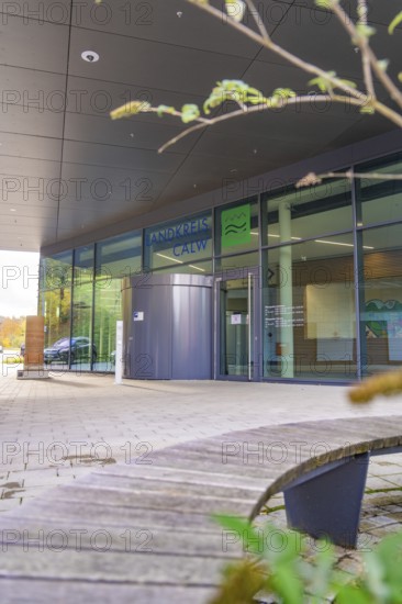 Modern building front with glass structure and leaf in the foreground, autumnal atmosphere, Calw District Office, Calw, Germany
