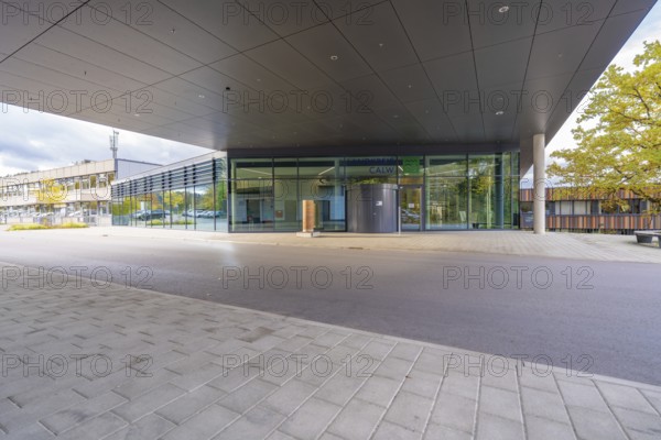 Modern building with covered entrance and large glass front, Calw District Office, Calw, Germany