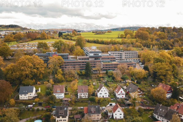Panoramic view of a small town in an autumnal landscape with surrounding fields, Calw District Office, Calw, Germany