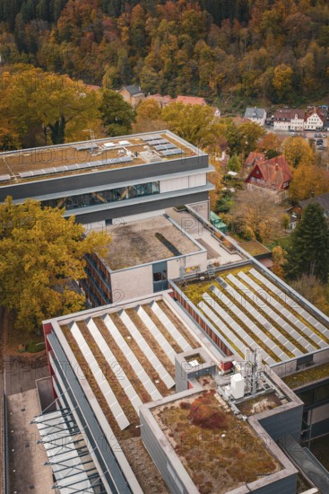 Building complex from above with a detailed roof and autumn surroundings, Calw District Office, Calw, Germany