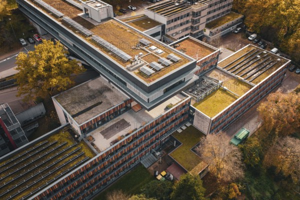 Modern architecture with green roofs and solar cells, nestled in an autumn environment, Calw District Office, Calw, Germany
