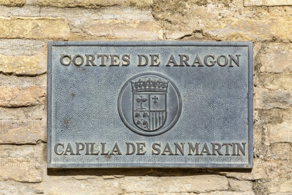 Sign for Cortes de Aragon, Capilla de San Martín, courtyard chapel of Saint Martin, Aljafería Palace, Zaragoza, Aragon, Spain