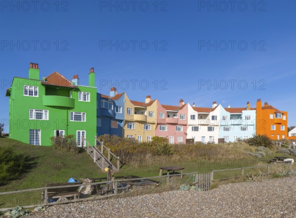 Colourful 1930s seaside houses called The Headlands on the beach at Thorpeness, Suffolk, England, UK