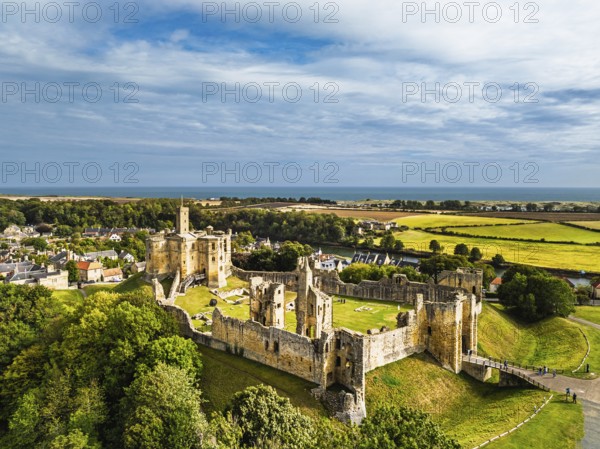 Warkworth Castle over River Coquet from a drone, Warkworth, Northumberland, England, United Kingdom
