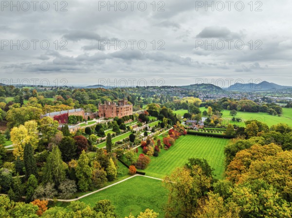 Autumn colours over Powis Castle and Garden from drone, Welshpool, Powys, Wales, England, United Kingdom