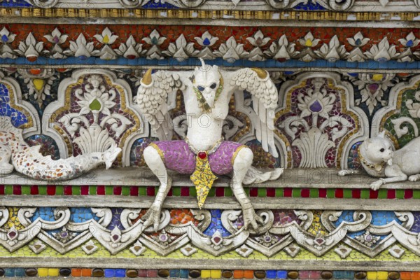 Decorative elements with pop culture references (for example comics, superheroes) in the stucco and porcelain vases outside and inside the art hall with modern art trends such as minimalism and abstraction, Wat Pariwat, Yan Nawa district, Bangkok, Thailand