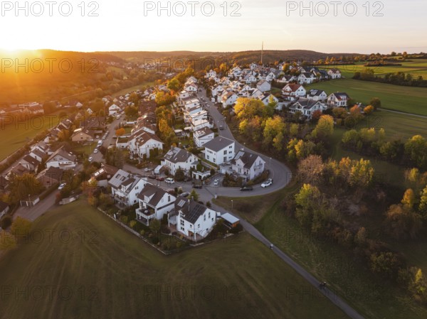 Panoramic view of a village and surrounding fields at sunset, Deufringen, Aidlingen, Böblingen district, Germany