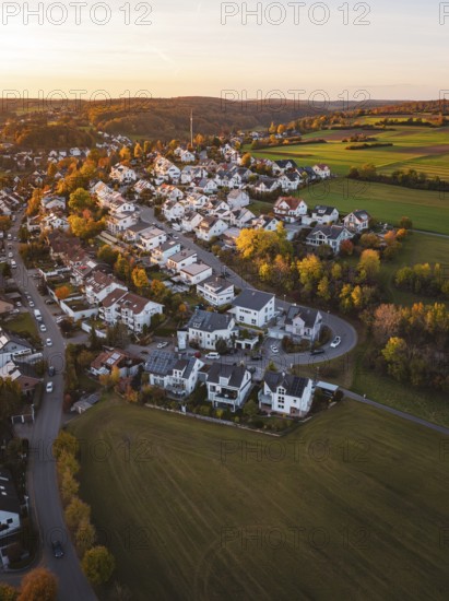 Aerial view of a village in autumn landscape at sunset, Deufringen, Aidlingen, Böblingen district, Germany