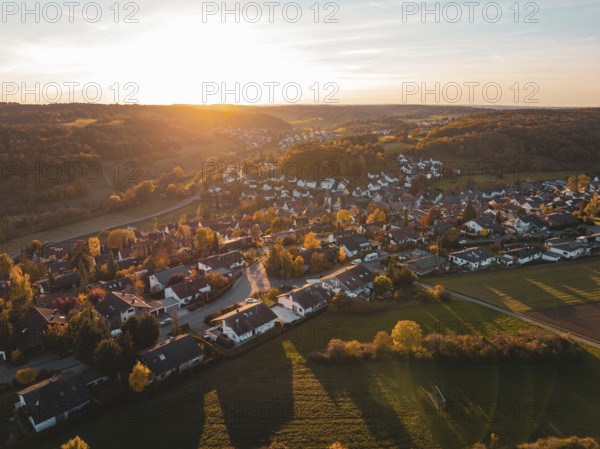 Autumn village at sunset with softly lit landscape, Deufringen, Aidlingen, Böblingen district, Germany