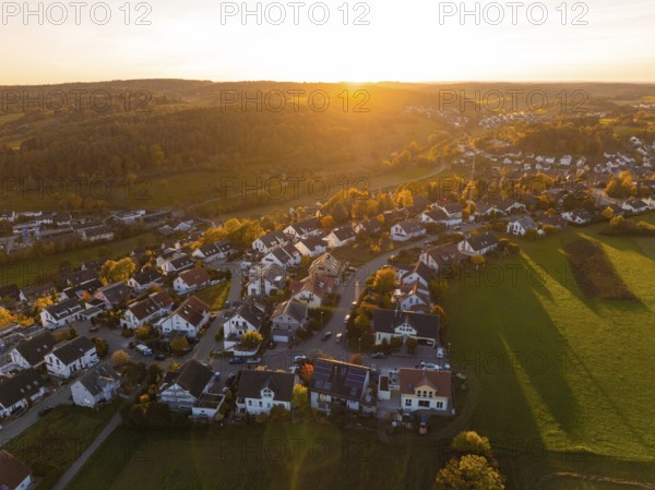 Village in the warm light of sunset, surrounded by countryside, Deufringen, Aidlingen, Böblingen district, Germany