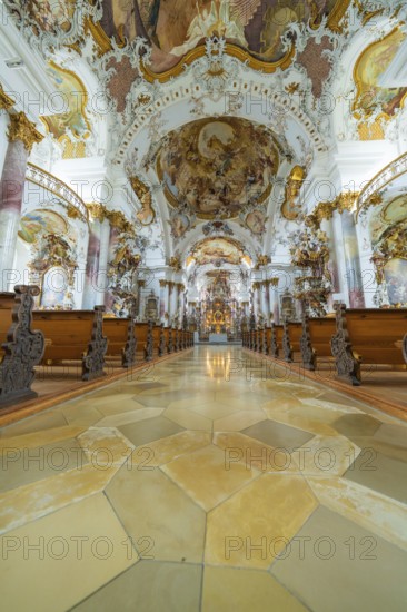 Magnificent baroque church corridor with artfully painted ceiling and decorative benches, ZFP Zwiefalten, Reutlingen district, Germany