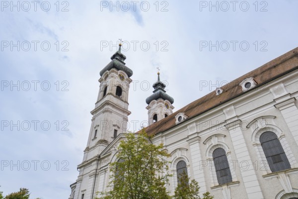 Baroque church with two towers and richly decorated exterior façade under cloudy sky, ZFP Zwiefalten, Reutlingen district, Germany