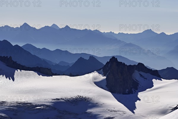 View of the snow-capped mountains from the Aiguille du Midi mountain station observation deck, Chamonix-Mont-Blanc, Haute-Savoie, France