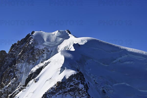 View of the snow-covered Mont Blanc du Tacul from the Aiguille du Midi, Chamonix-Mont-Blanc, Haute-Savoie, France