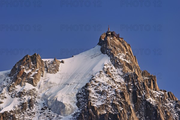 Snowy Aiguille du Midi in the evening light, Mont-Blanc, Chamonix-Mont-Blanc, Haute-Savoie, France