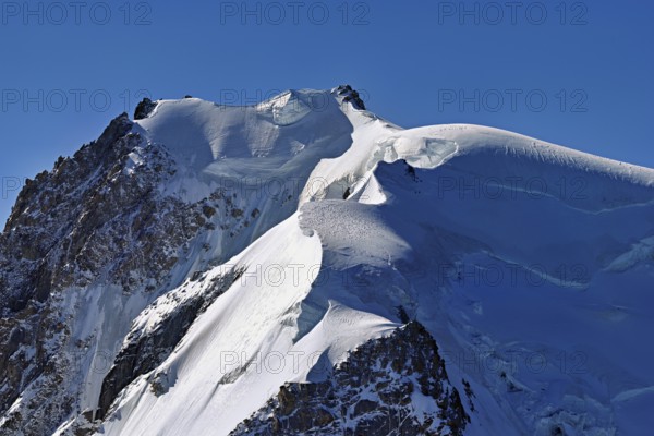 View of the snow-covered Mont Blanc du Tacul from the Aiguille du Midi, Chamonix-Mont-Blanc, Haute-Savoie, France