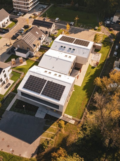 Aerial view of a Kita Hasenbrunnen building with solar panels in a residential area, Nagold, Black Forest, Germany