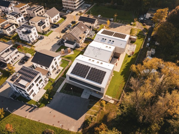 Aerial view of a modern residential area Kita Hasenbrunnen with solar panels and autumn surroundings, Nagold, Black Forest, Germany