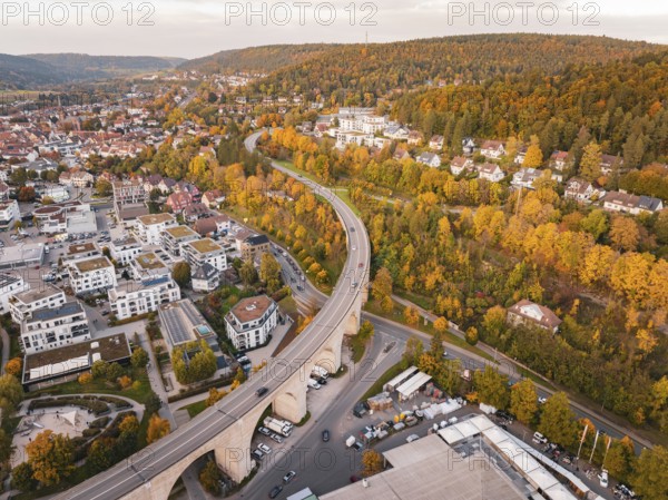 Aerial view of a modern residential area with a park-like area and colorful autumn leaves, Nagold, Black Forest, Germany