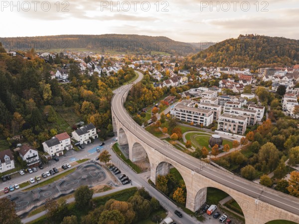 Urban landscape with bridge and autumn trees in the golden hour, Nagold, Black Forest, Germany