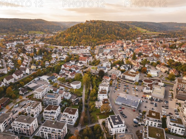 Aerial view of a city with surrounding hills and autumnal atmosphere, Nagold, Black Forest, Germany