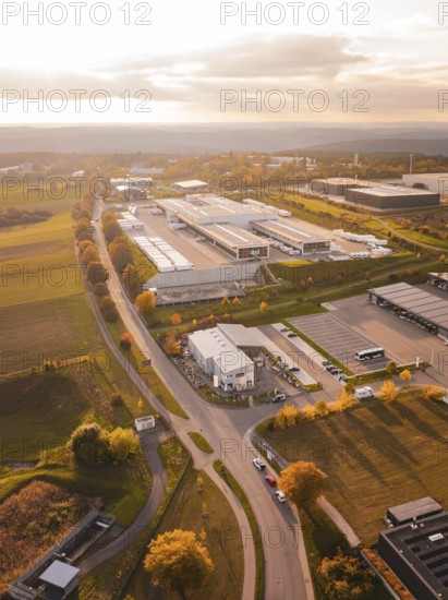 Roads lead through an industrial park with isolated buildings and adjacent fields, DPD, Nagold, Black Forest, Germany