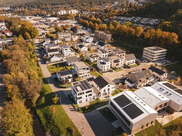 Modern residential buildings with solar panels in autumn surroundings, Nagold, Black Forest, Germany