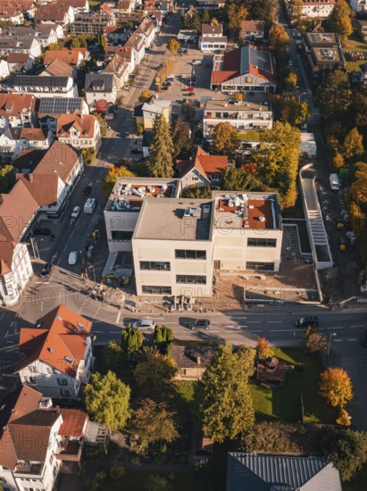 City district in autumn with colorful leaves and modern architecture, Nagold, Black Forest, Germany