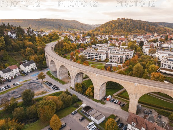 Aerial view of a city with a long bridge in an autumn scene, Nagold, Black Forest, Germany
