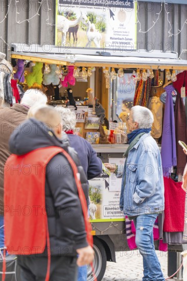 People in front of a market stand selling clothes and accessories, Streuobstmarkt, Sindelfingen, Böblingen district, Germany