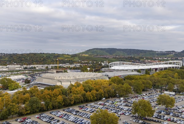 Neckarpark Stuttgart with Hanns-Martin-Schleyer-Hall and MHP Arena. Cars parked on the Wasen fairground. Stuttgart, Baden-Württemberg, Germany
