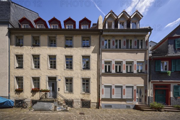 Historic buildings, houses, downpipes, façade with windows, dormers, stairs and doors, paving stone walkway, blue sky, cirrostratus clouds, Rochusstraße, Mainz, state capital, district-free city, Rhineland-Palatinate, Germany