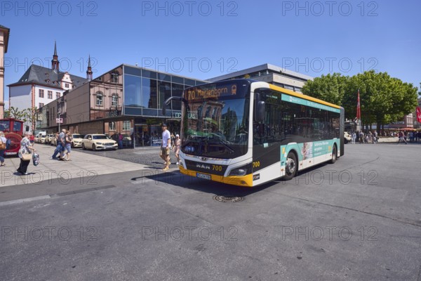 Commercial building, general architecture, modern building, perfumery, Douglas, public bus, bus line 70 Marienborn, pedestrians as accessories, trees, blue sky, cloudless, intersection of Gutenbergplatz with Schöfferstraße and Höfchen, Mainz, state capital, district-free city, Rhineland-Palatinate, Germany