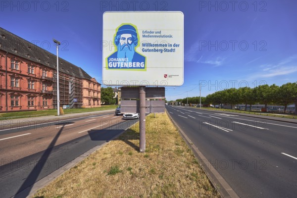 Welcome to Gutenberg City, tourist sign, roads, lanes, central island, lantern, trees, lawn, blue sky, cirrostratus clouds, federal road B40, Peter-Altmeier-Allee, Mainz, state capital, district-free city, Rhineland-Palatinate, Germany